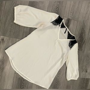 White blouse with black lace detail